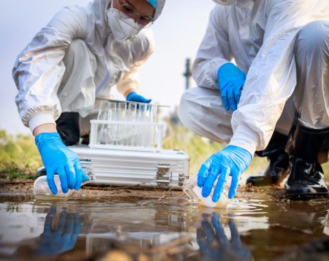 two-scientists-in-protective-suits-and-masks-took-2023-11-27-05-35-57-utc